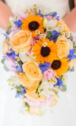 Photo by Thomas William woman holding bouquet of flowers